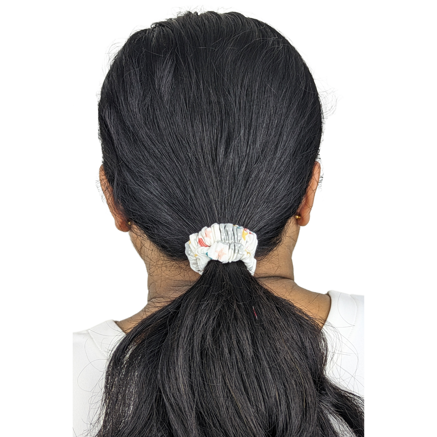 Woman wearing a Popstar Tiny Tie scrunchie
