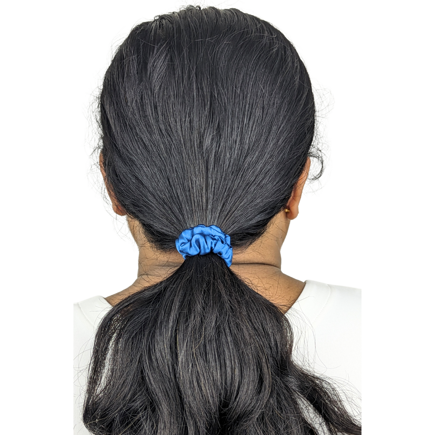 Woman wearing a Satin Blue Tiny Tie scrunchie