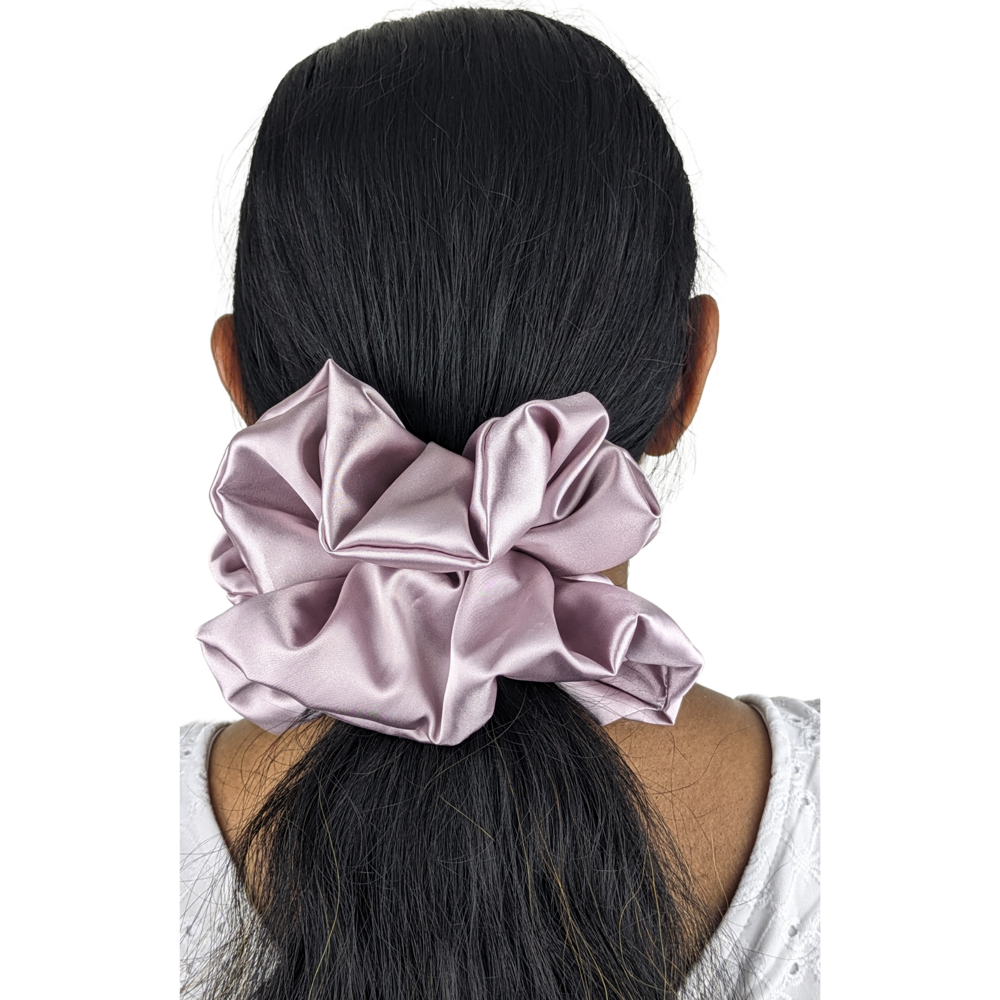 Woman wearing large pink rose scrunchie