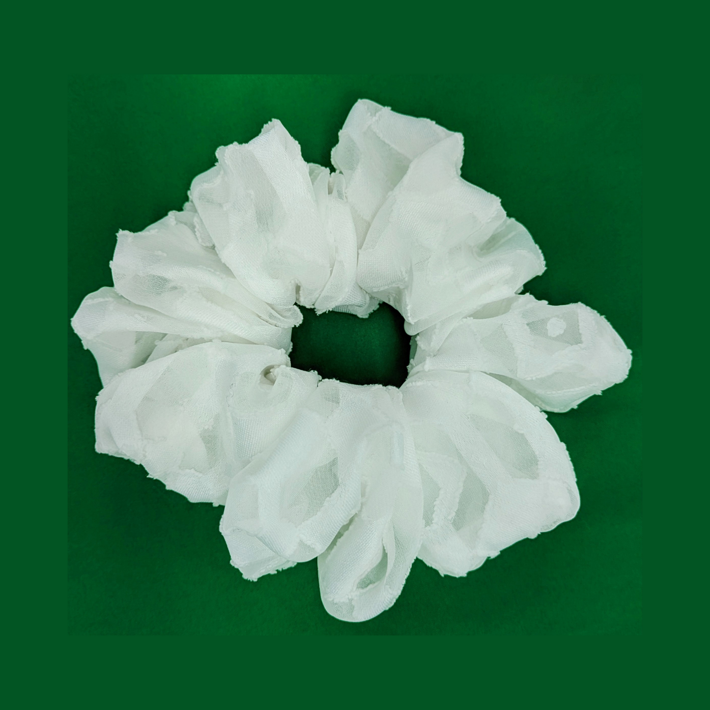 Large white Scrunchie made with 60% Polyester and 40% viscose fabric blend.