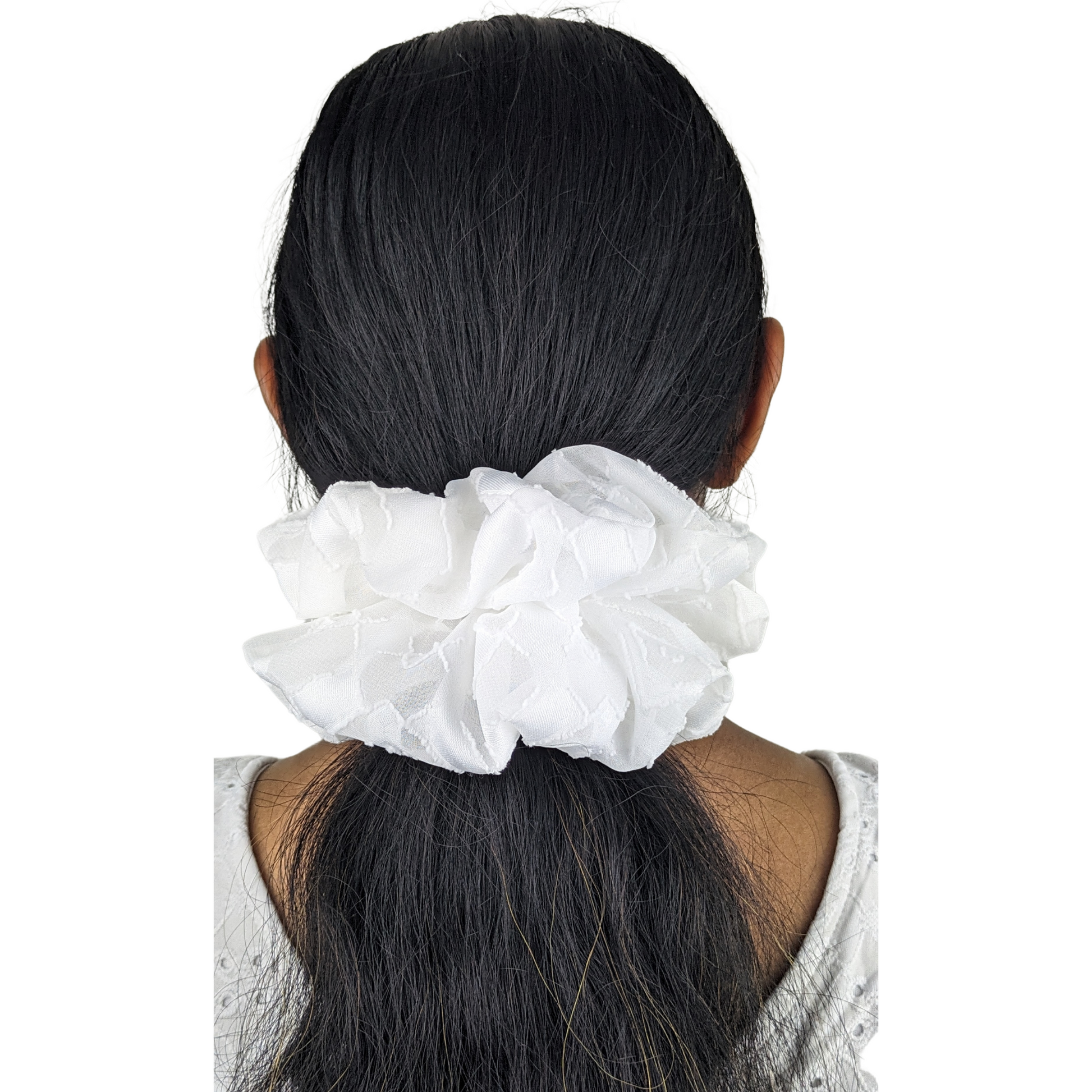 Woman wearing large white scrunchie made with 60% polyester and 40% viscose fabric blend.